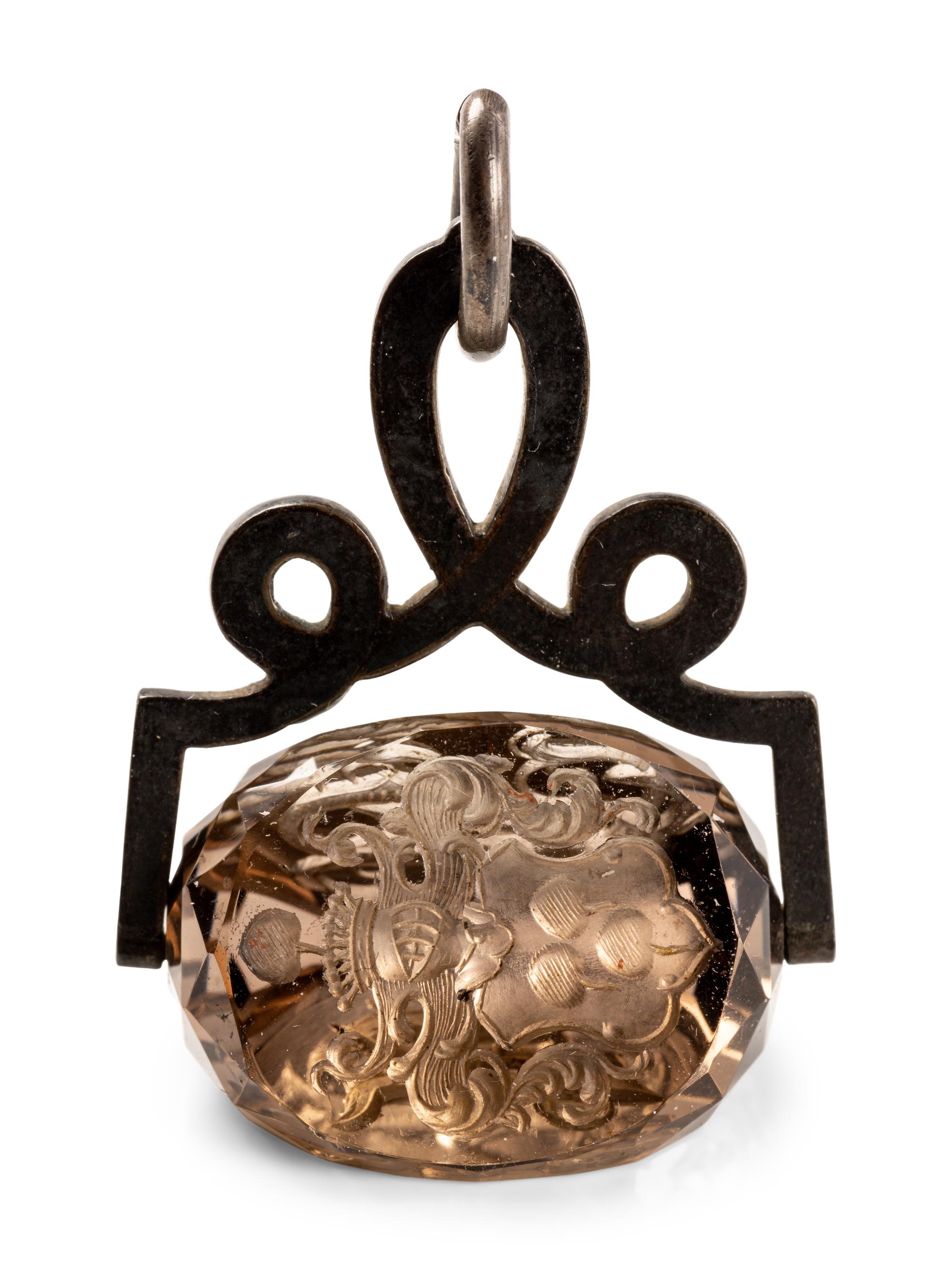 A German Carved Topaz and Gilt Metal Mounted Hand Seal