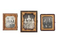 [EARLY PHOTOGRAPHY]. 22 quarter and sixth plate daguerreotype portraits of pairs and trios.