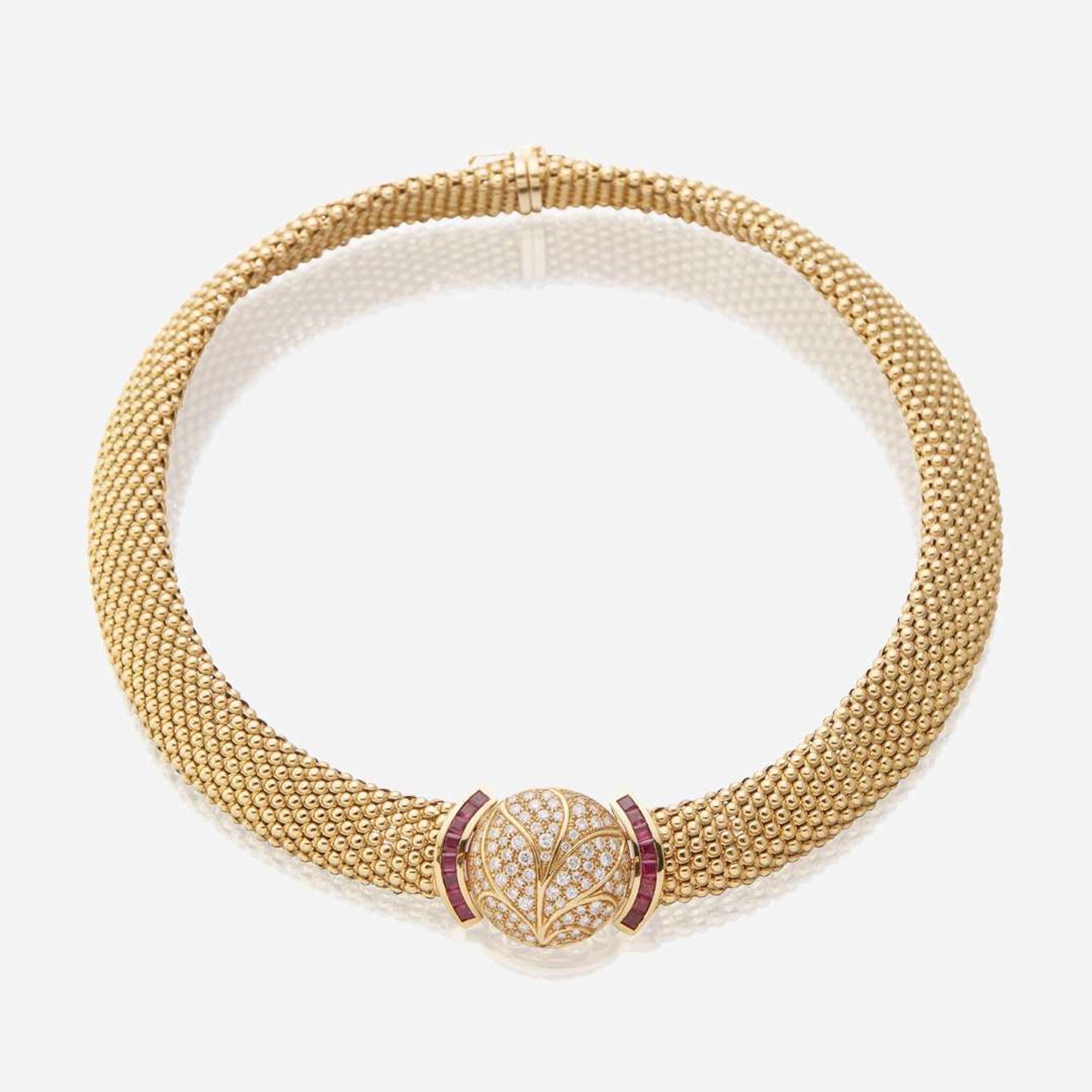 An eighteen karat gold, diamond, and ruby necklace