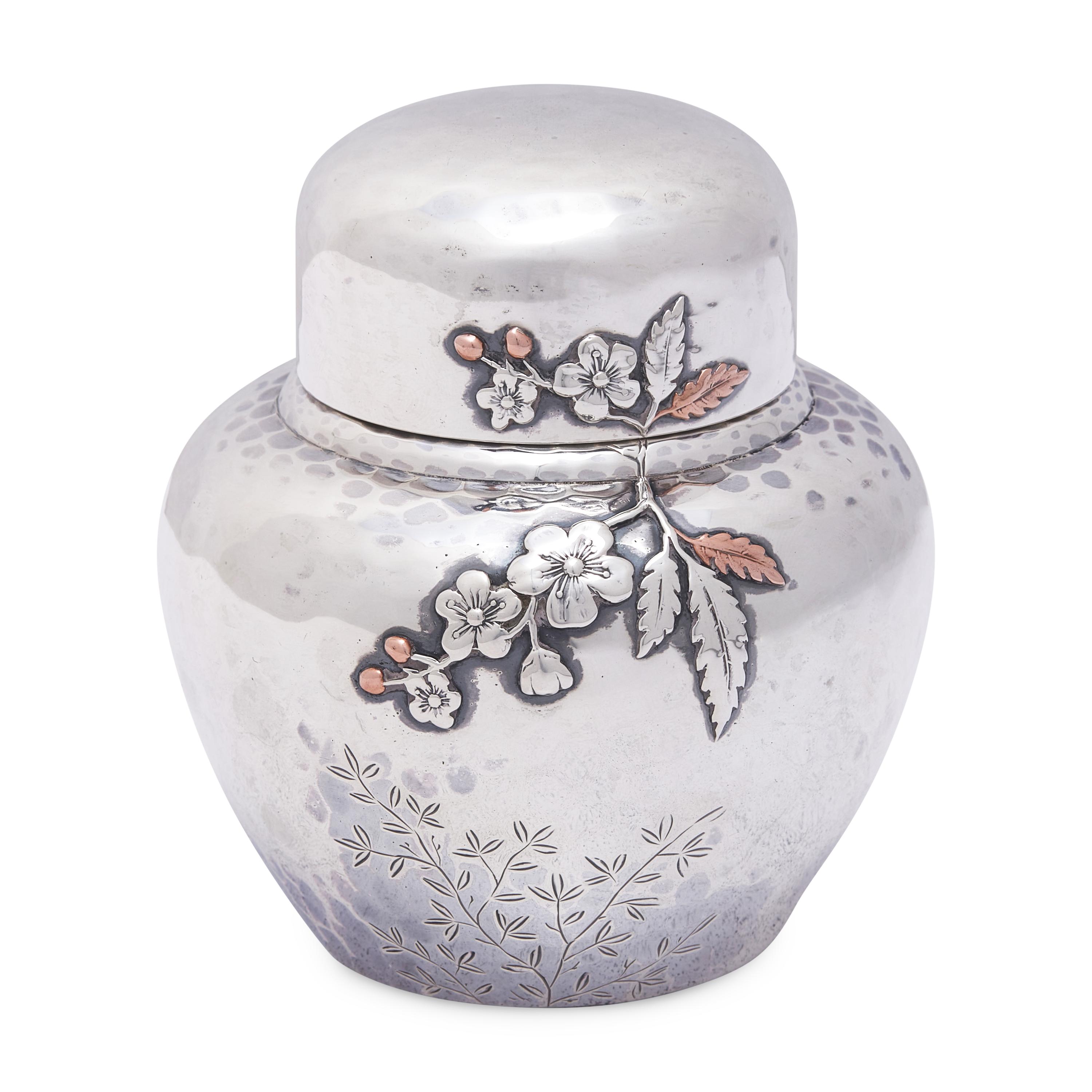 An Aesthetic Movement Japanesque Hammered Sterling Silver and Mixed Metal Tea Caddy