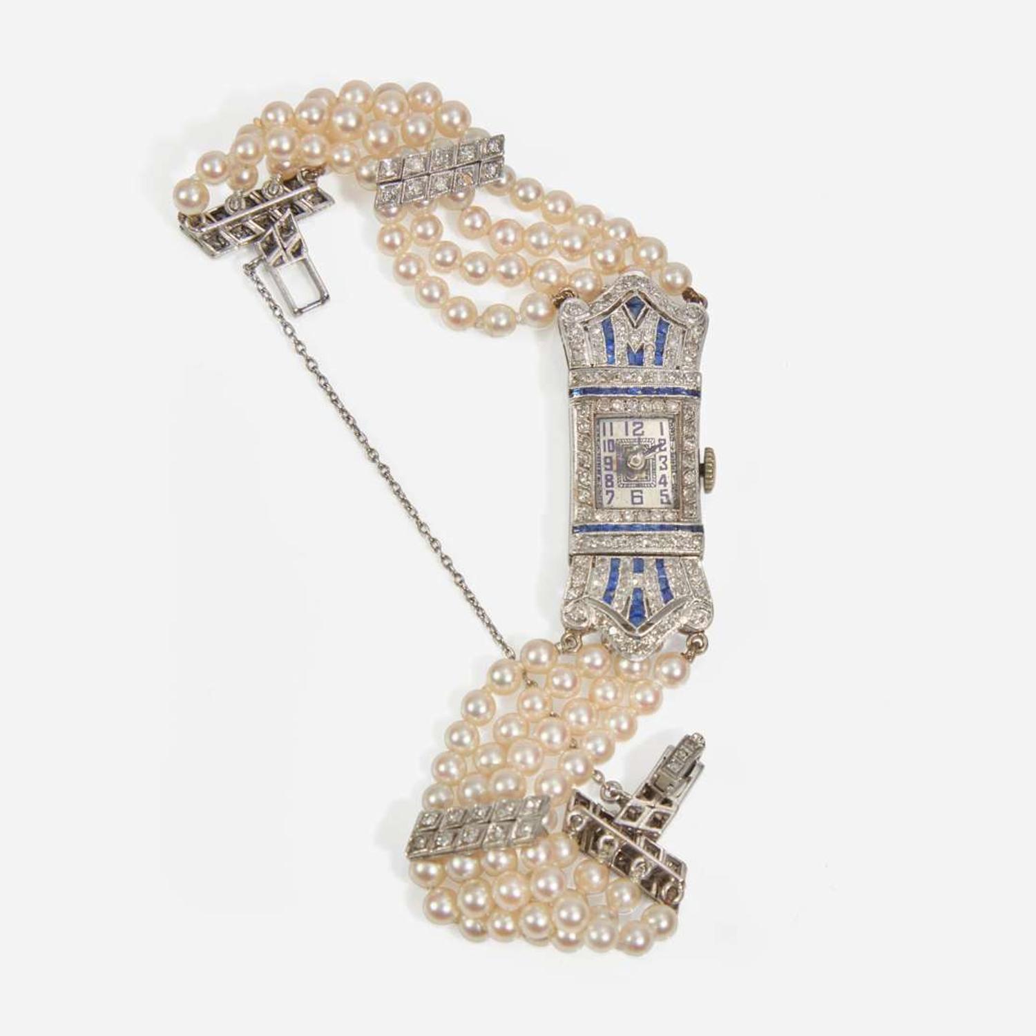 An Art Deco Pearl, Diamond, and Sapphire Watch