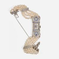 An Art Deco Pearl, Diamond, and Sapphire Watch