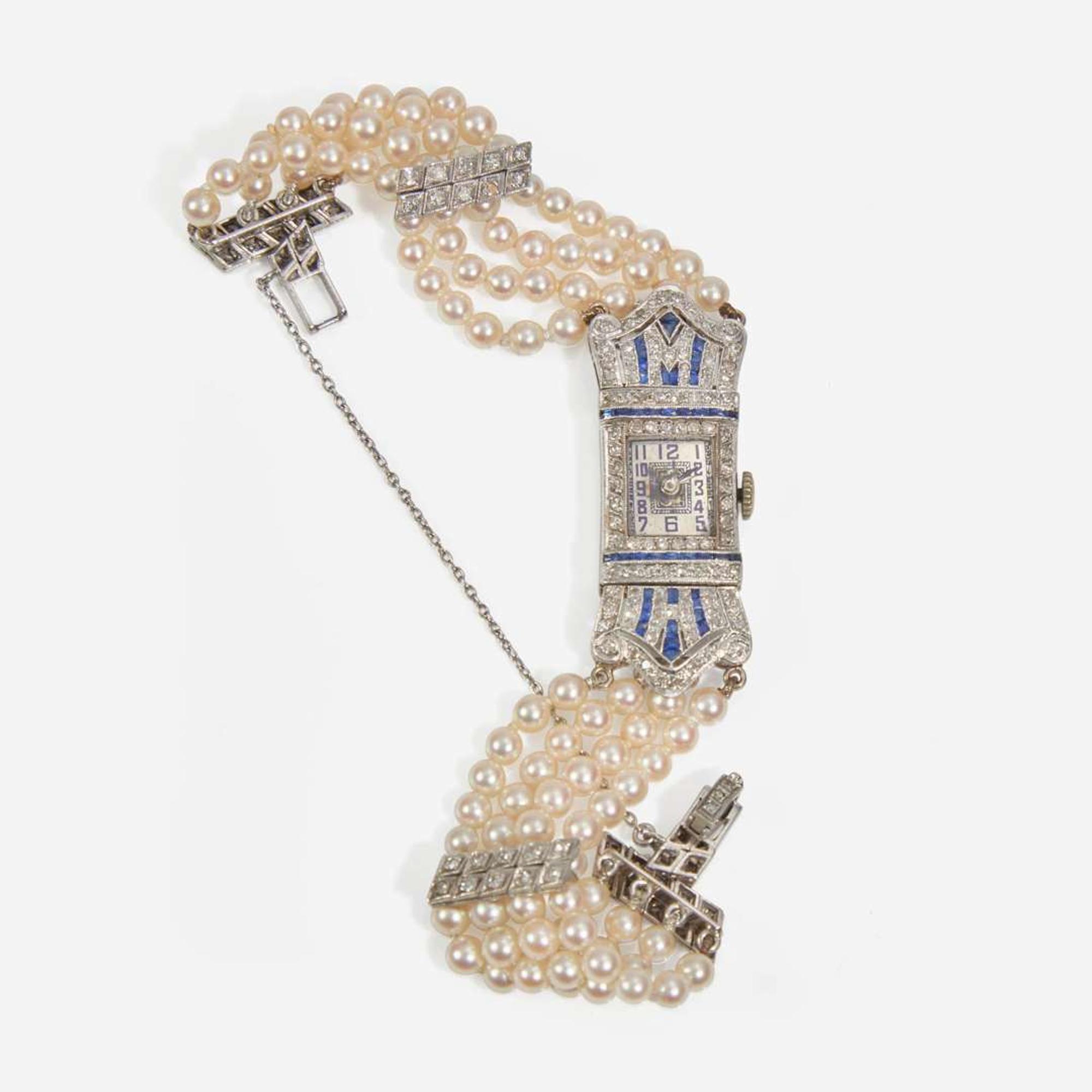 An Art Deco Pearl, Diamond, and Sapphire Watch