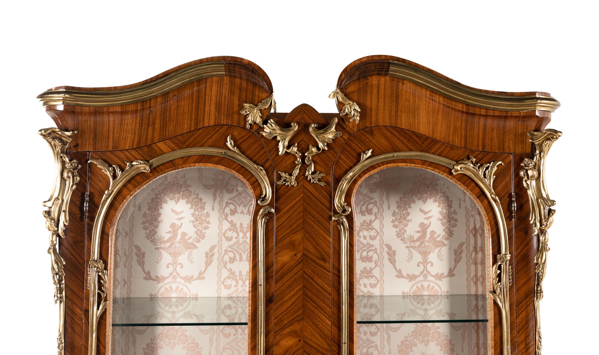 A Pair of Louis XV Style Gilt Bronze Mounted Tulipwood Vitrine Cabinets