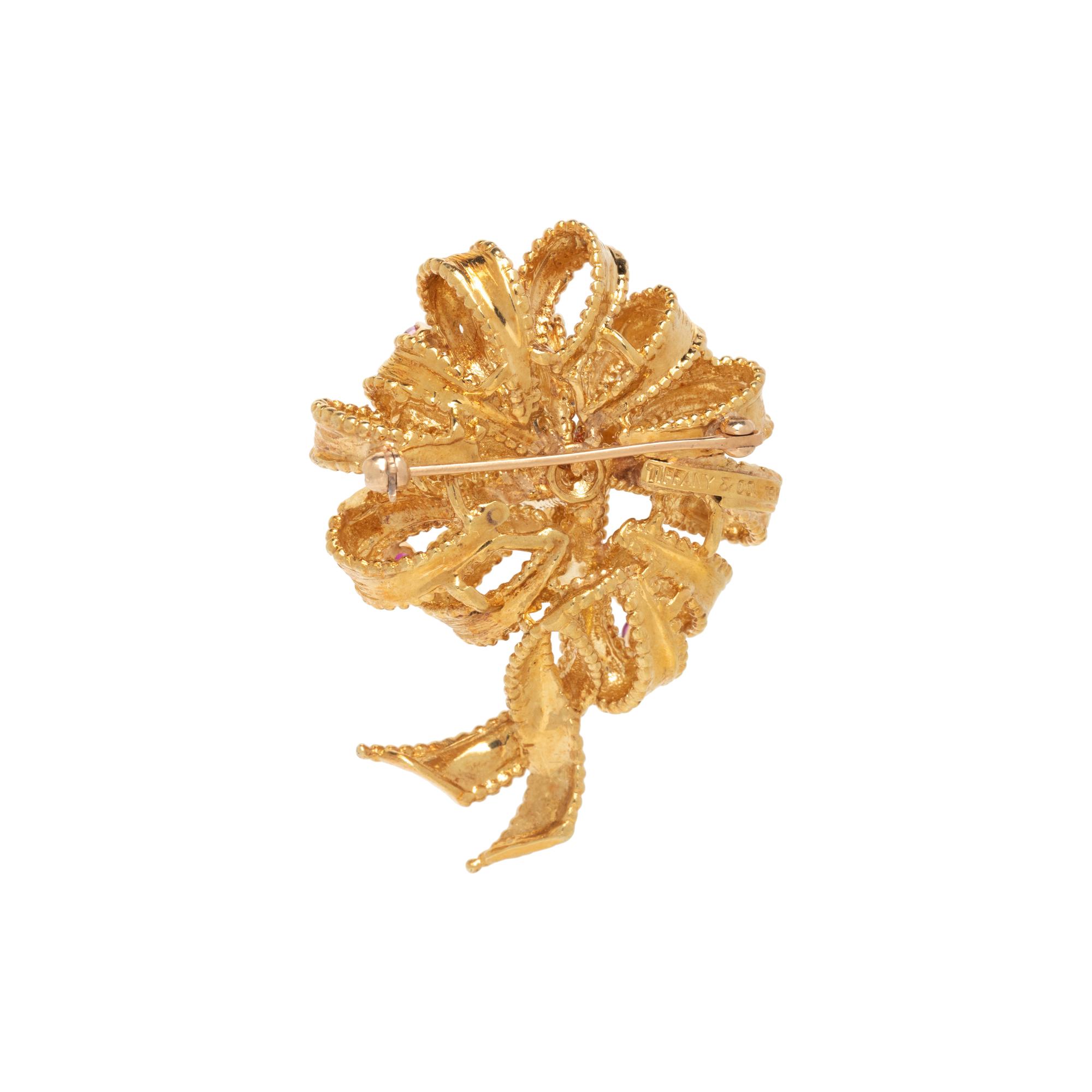 TIFFANY & CO., RUBY AND YELLOW GOLD RIBBON BROOCH