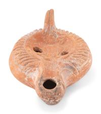 A Roman Terracotta Discus Lamp Depicting the God Hermes