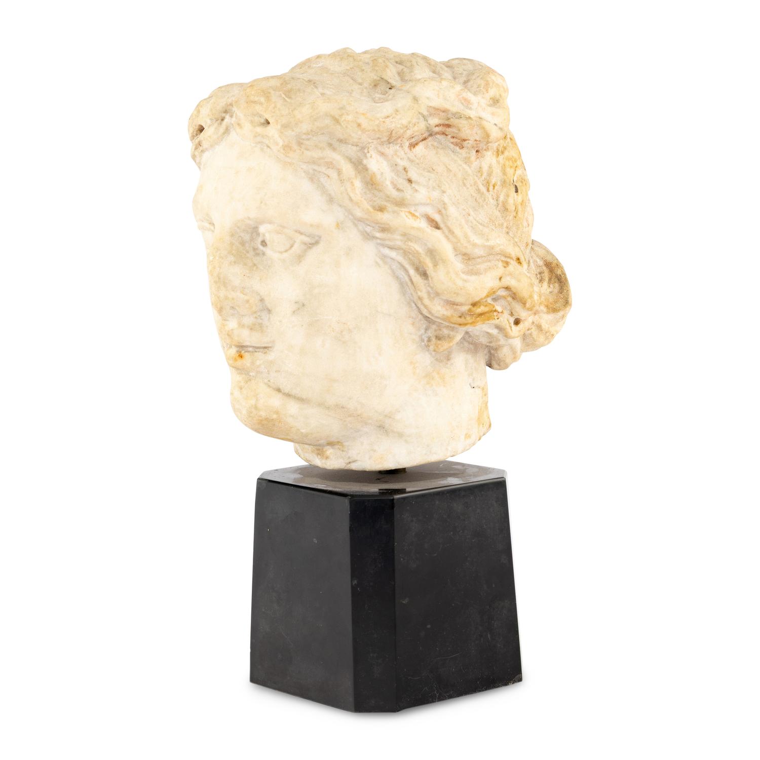 A Continental Carved Marble Head of a Woman