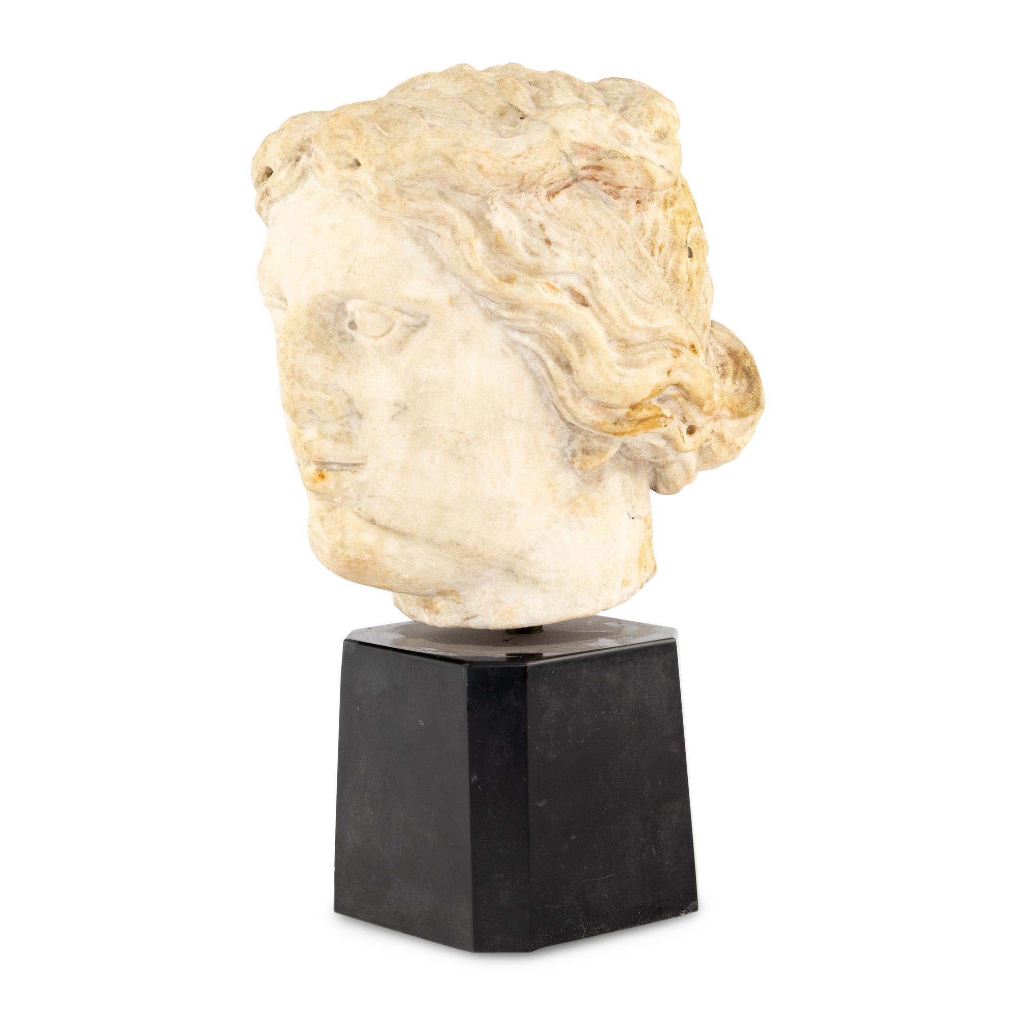 A Continental Carved Marble Head of a Woman