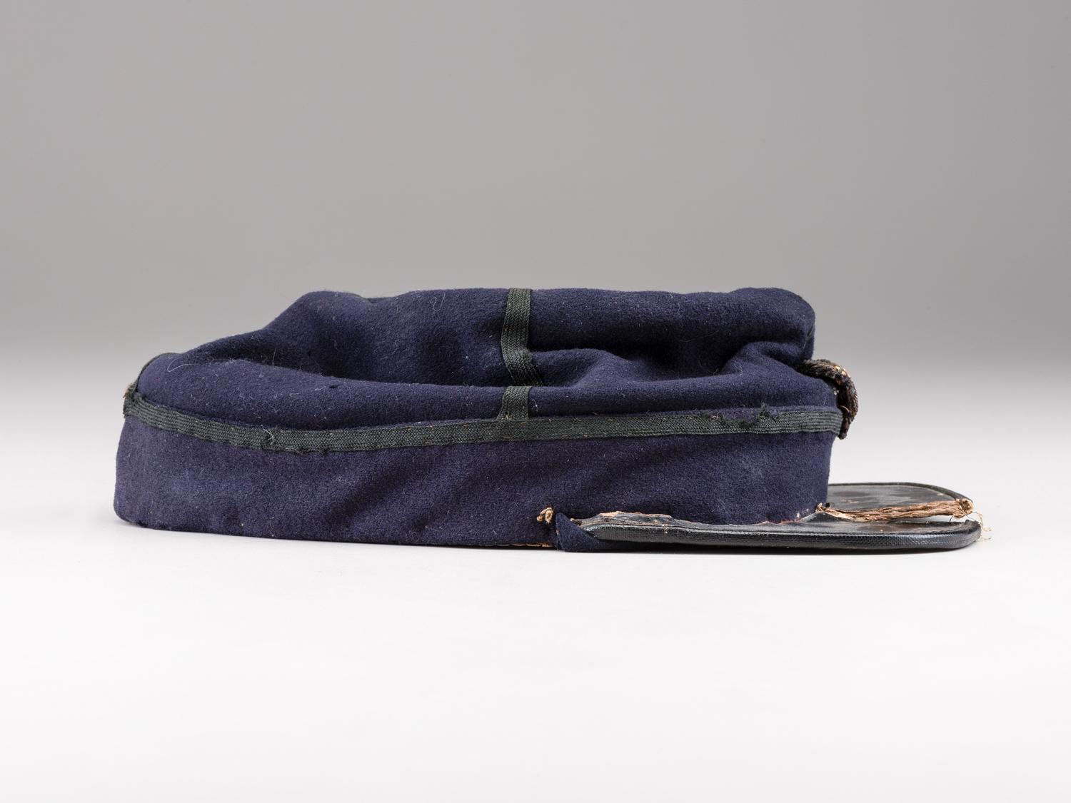 [CIVIL WAR]. Private purchase officer's sack coat, kepi, and carpet bag identified to Lieutenant Albert C. Sparks, Co. B, 37th Massachusetts Volunteers.