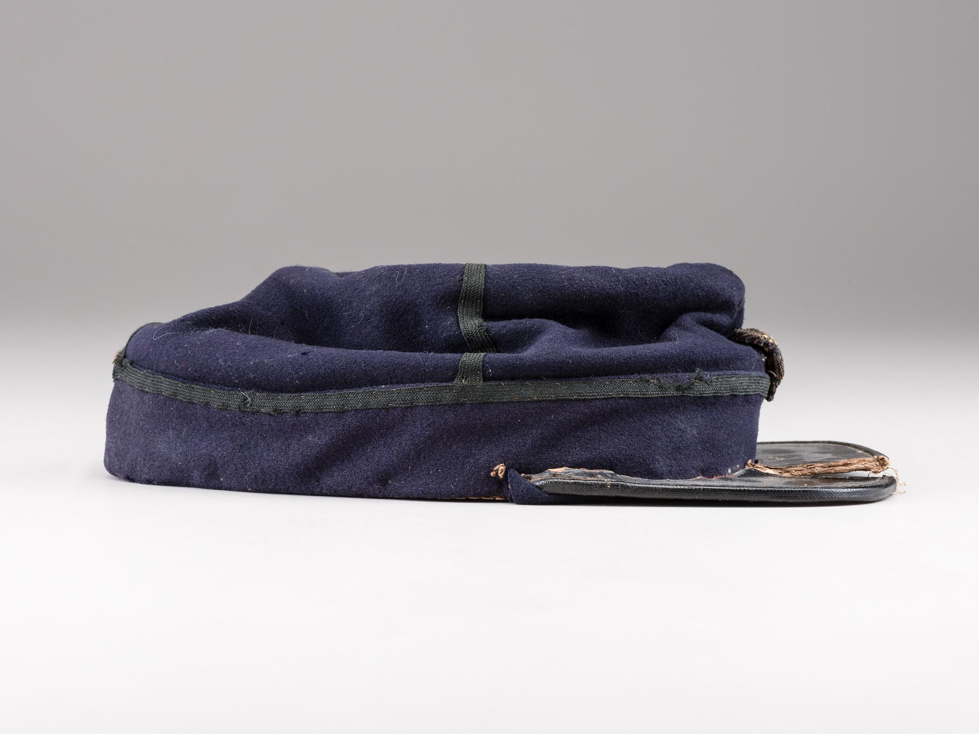 [CIVIL WAR]. Private purchase officer's sack coat, kepi, and carpet bag identified to Lieutenant Albert C. Sparks, Co. B, 37th Massachusetts Volunteers.