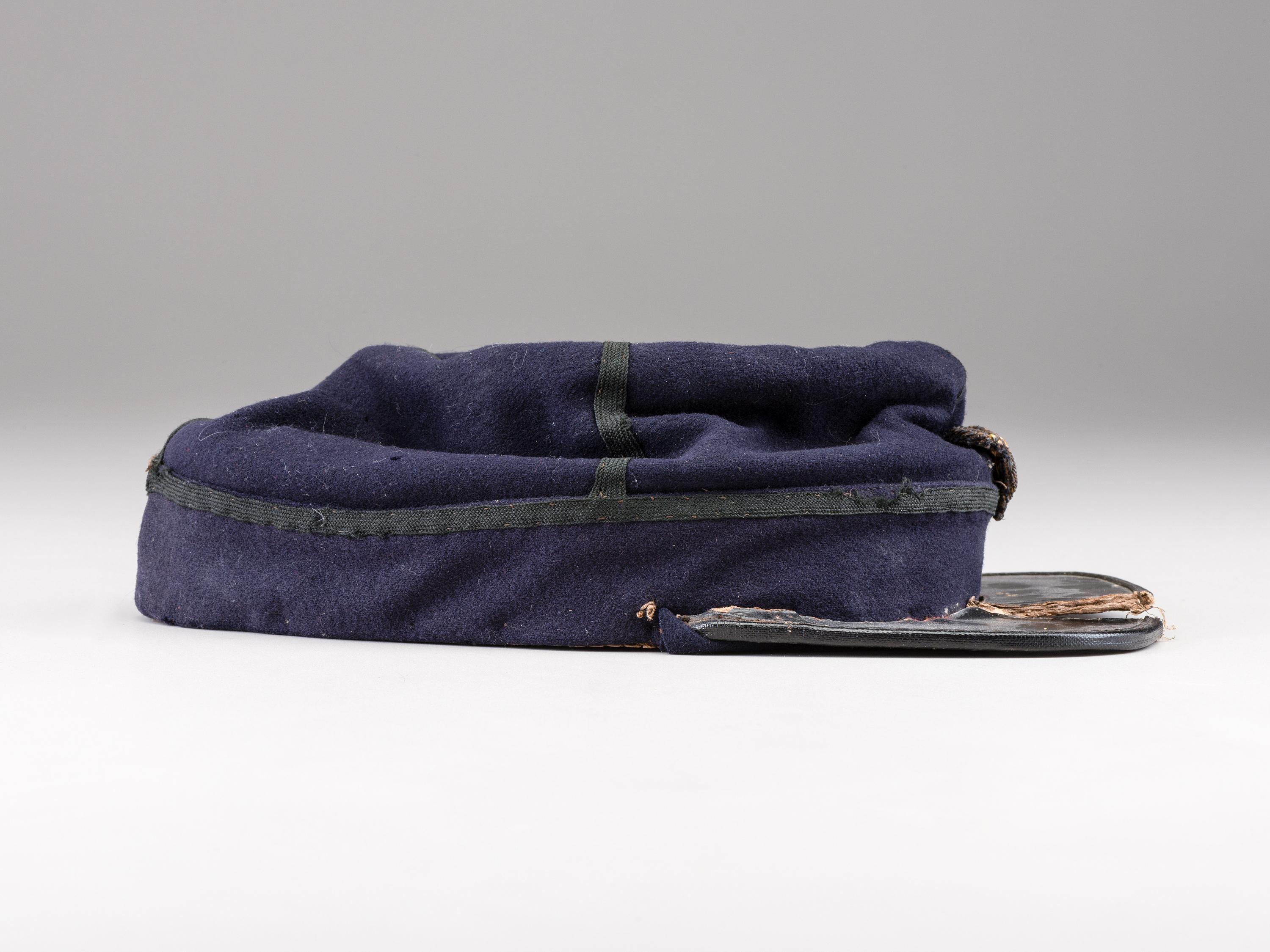 [CIVIL WAR]. Private purchase officer's sack coat, kepi, and carpet bag identified to Lieutenant Albert C. Sparks, Co. B, 37th Massachusetts Volunteers.