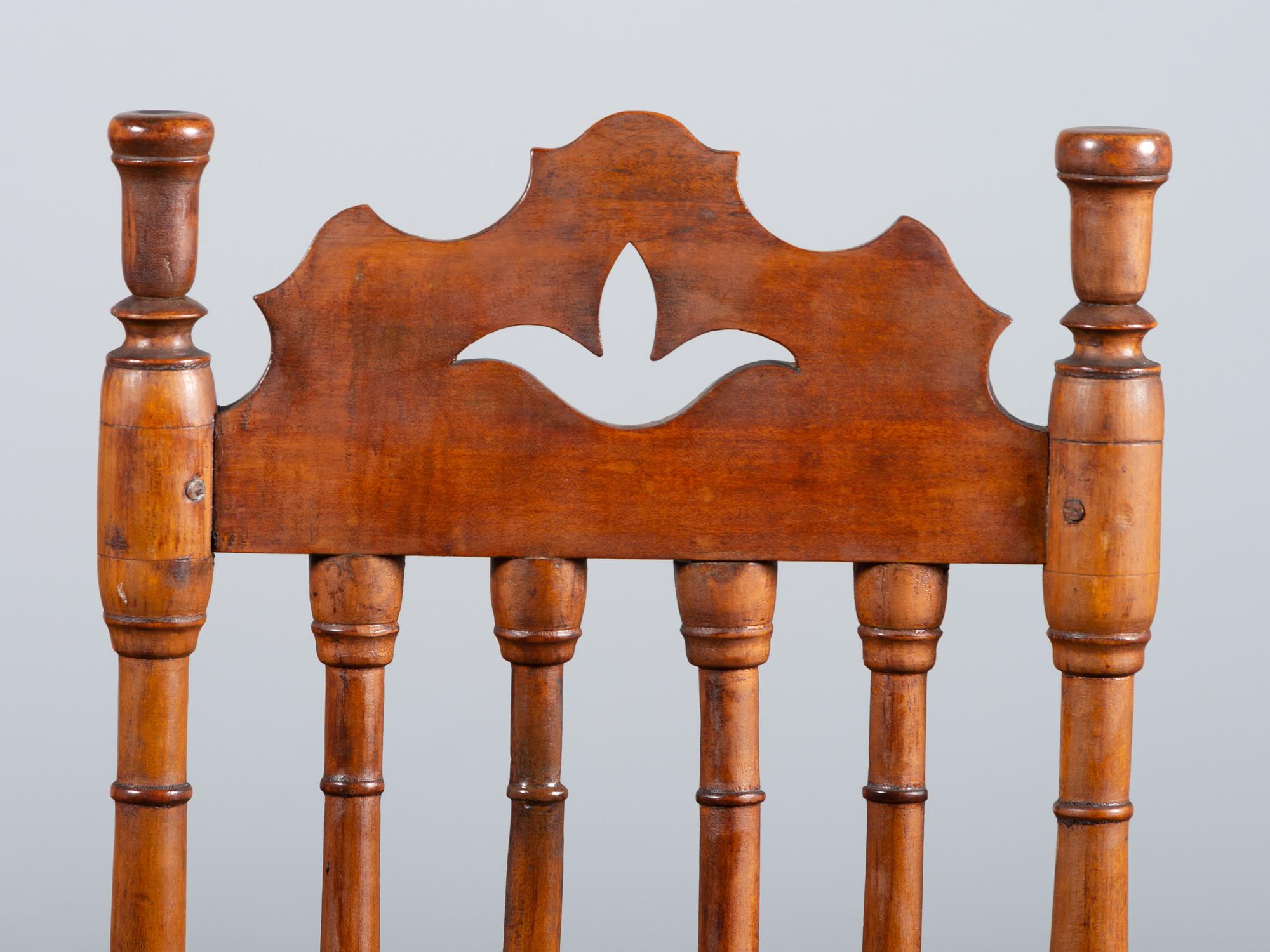 A William and Mary Style Turned and Pierced Carved Banister-Back Rush Seat Side Chair
