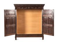 A Continental Carved Oak Wardrobe Cabinet