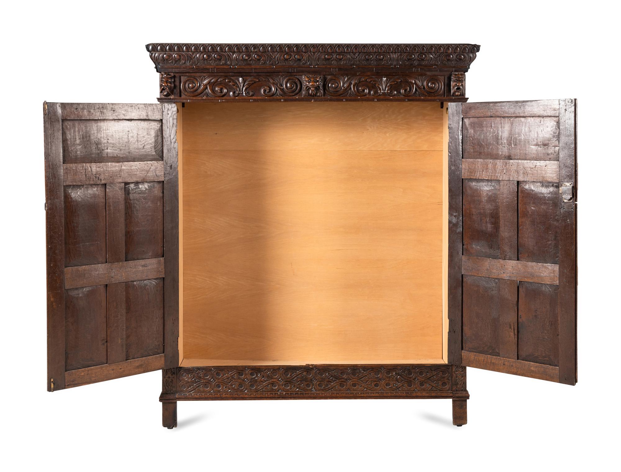 A Continental Carved Oak Wardrobe Cabinet