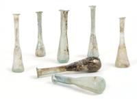 A Collection of Seven Roman Glass Unguentariums, Height of tallest 5 inches.