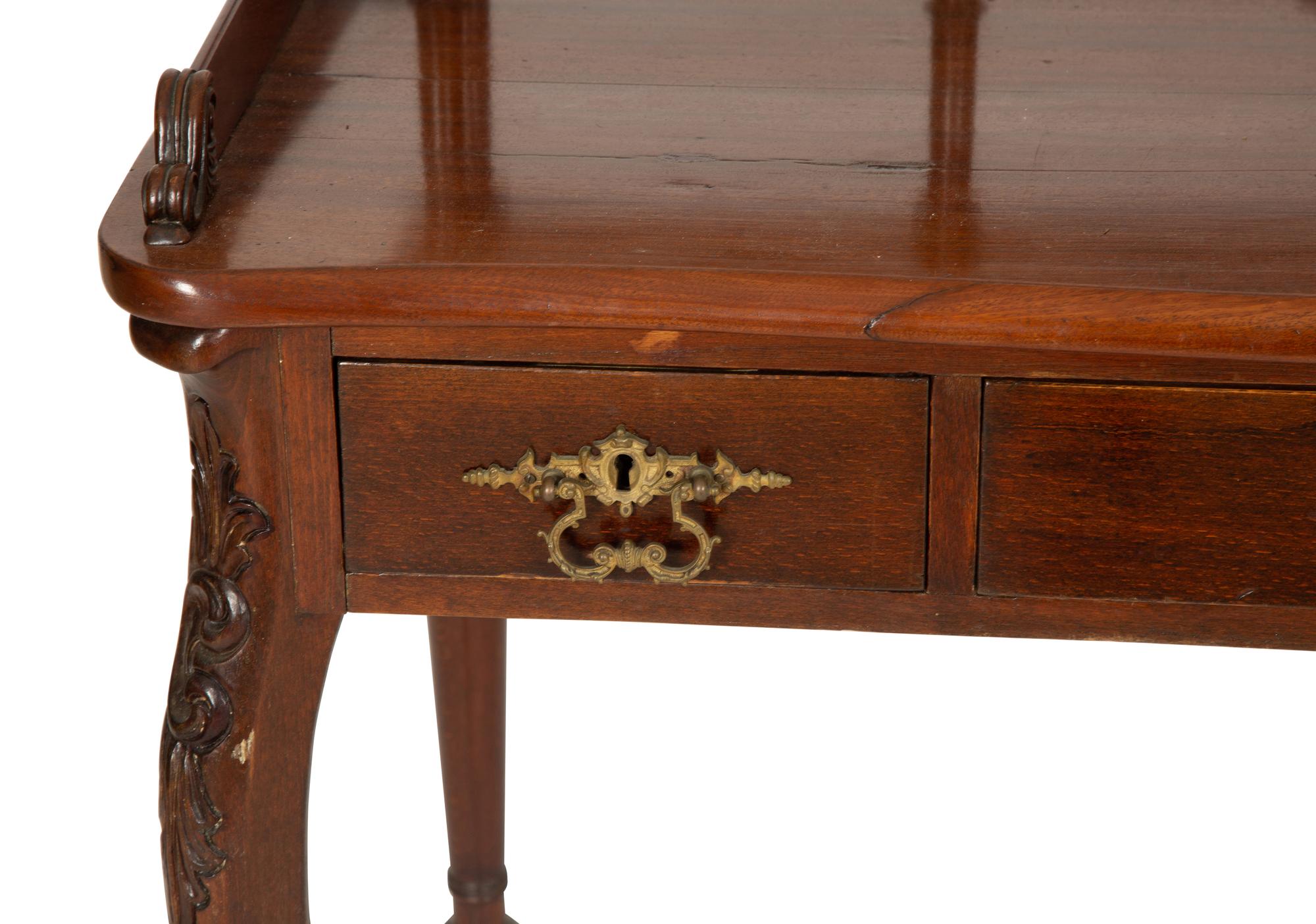 A Victorian Mahogany Lady's Writing Table with Shelf