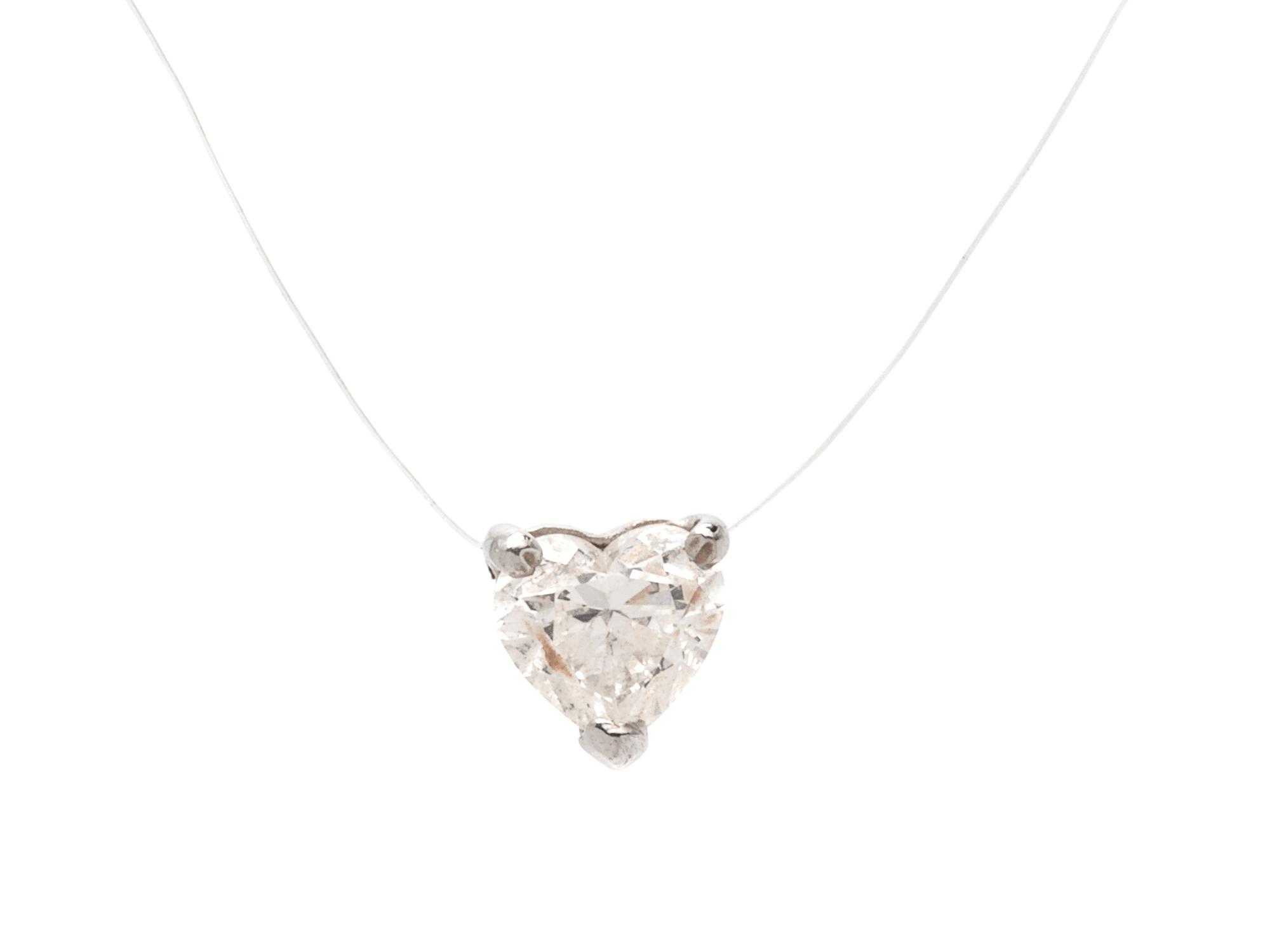 A Platinum and Diamond Heart Pendant,
