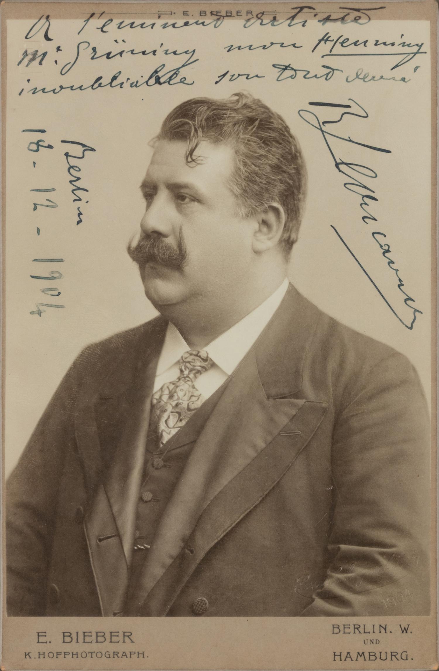LEONCAVALLO, Ruggiero (1857-1919). Black and white photographic portrait, signed (“R. Leoncavallo”) and additionally inscribed, Berlin, 18 December 1904.