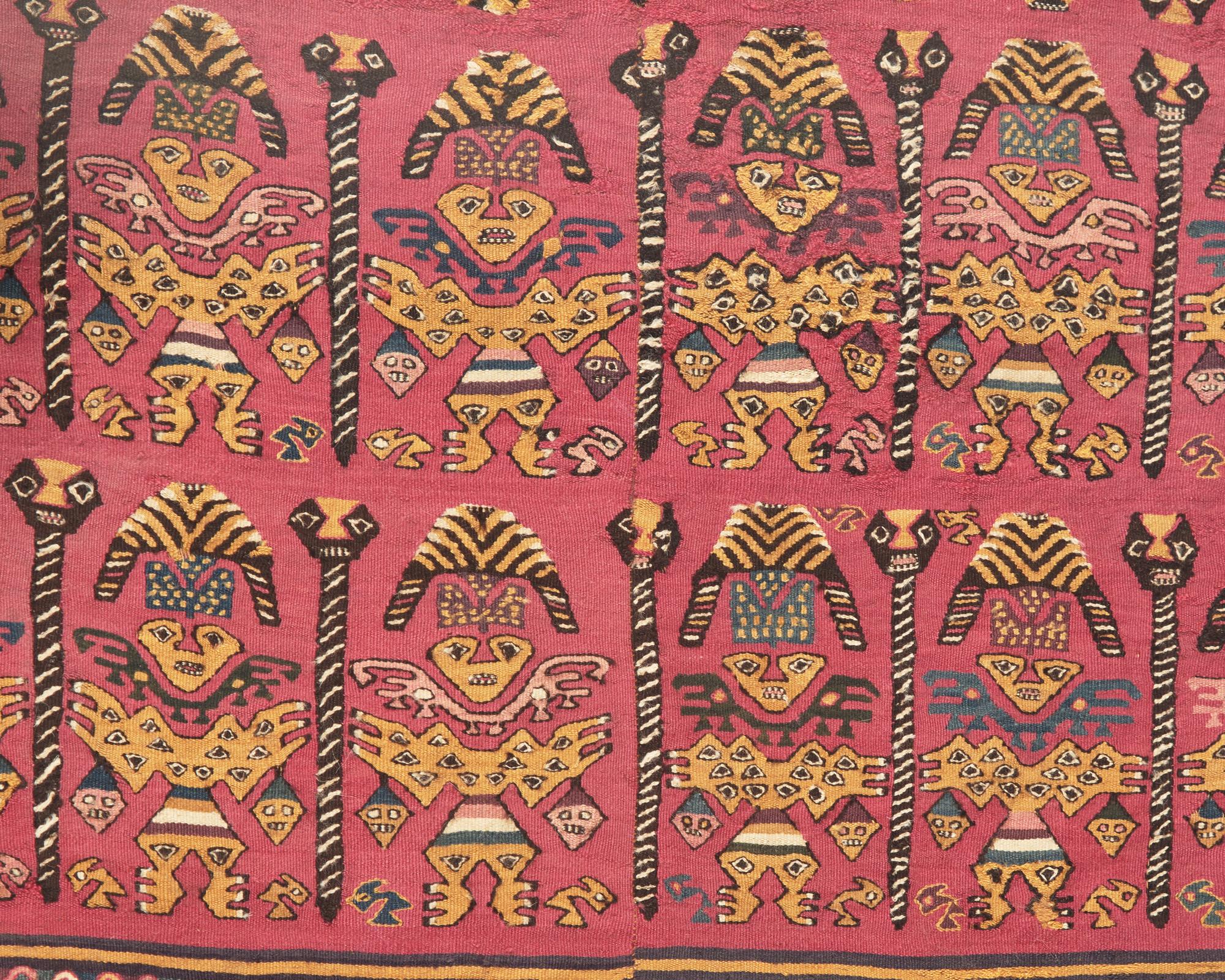 A Chimu Unku Textile with Warriors Carrying Heads