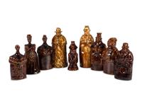 Nine Figural Flasks in Brown Glaze