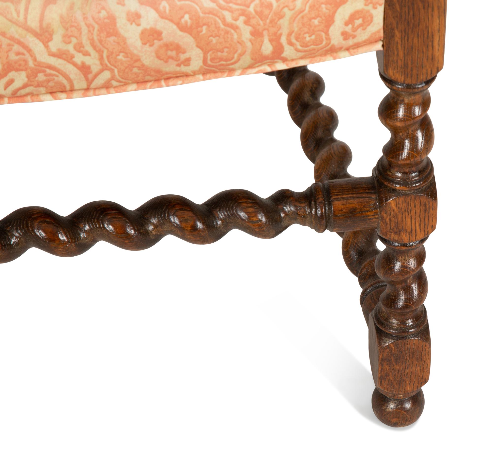 A William and Mary Style Carved Oak Cane Back Armchair