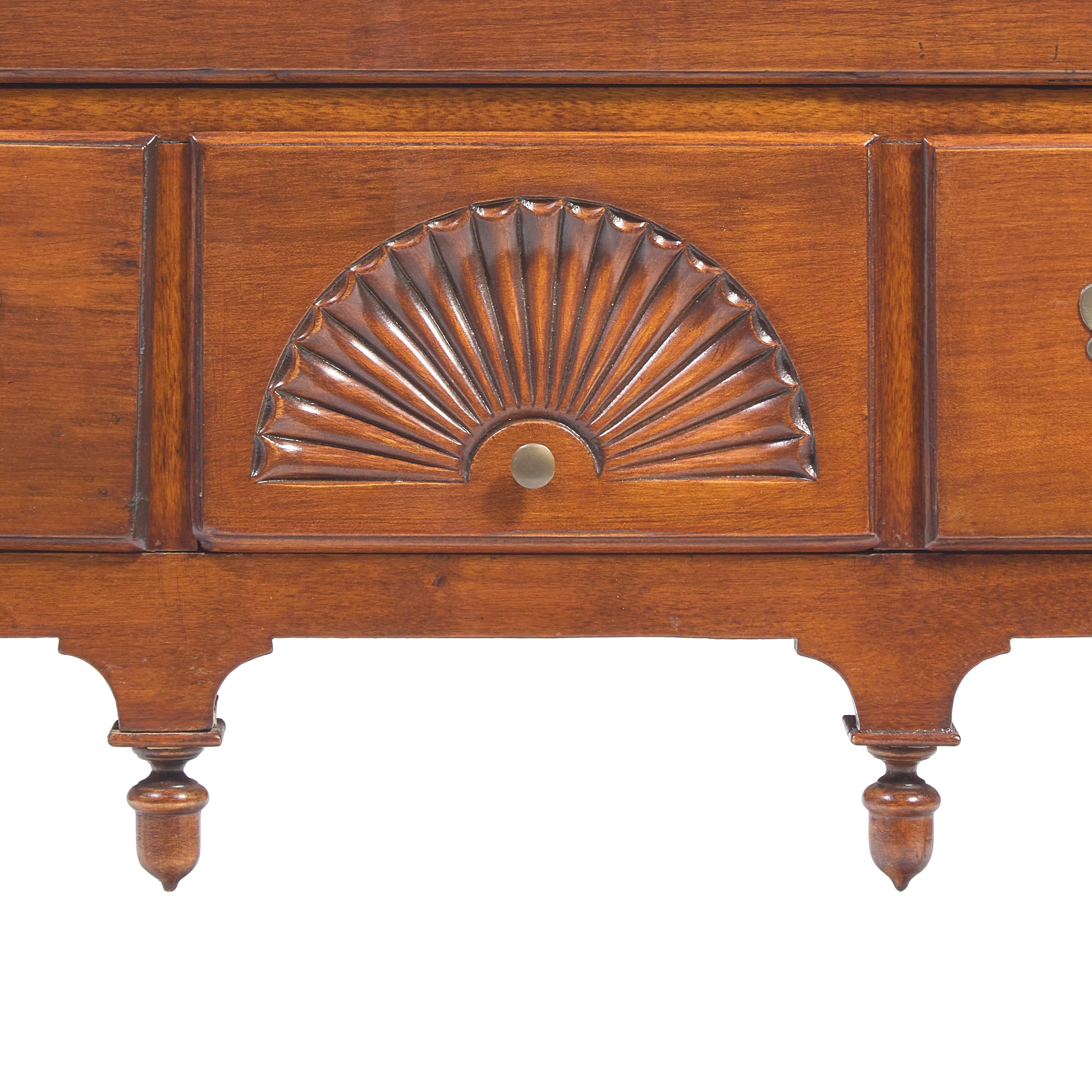 A Queen Anne Fan-Carved Cherrywood Pad-Foot Dressing Table