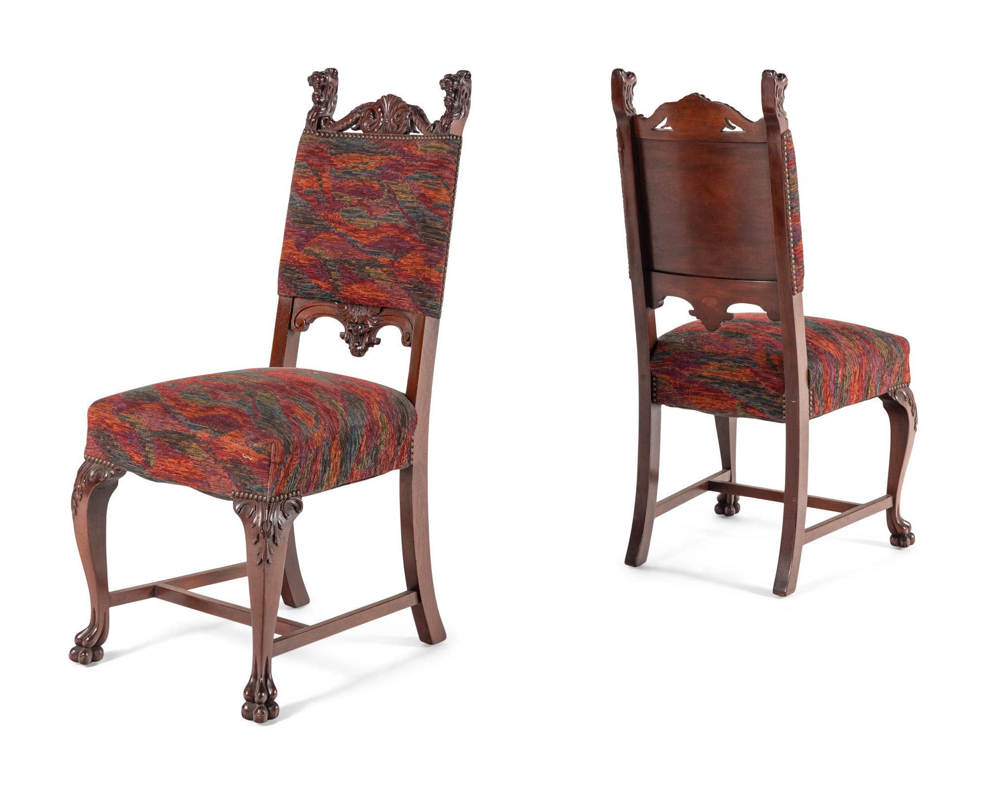 A Renaissance Revival Carved Mahogany Dining Table and Set of Six Chairs
