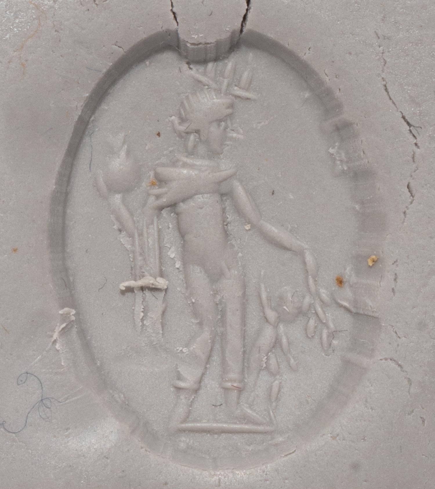 A Roman Carnelian Ring Stone with the God Mercury and the Infant Dionysus