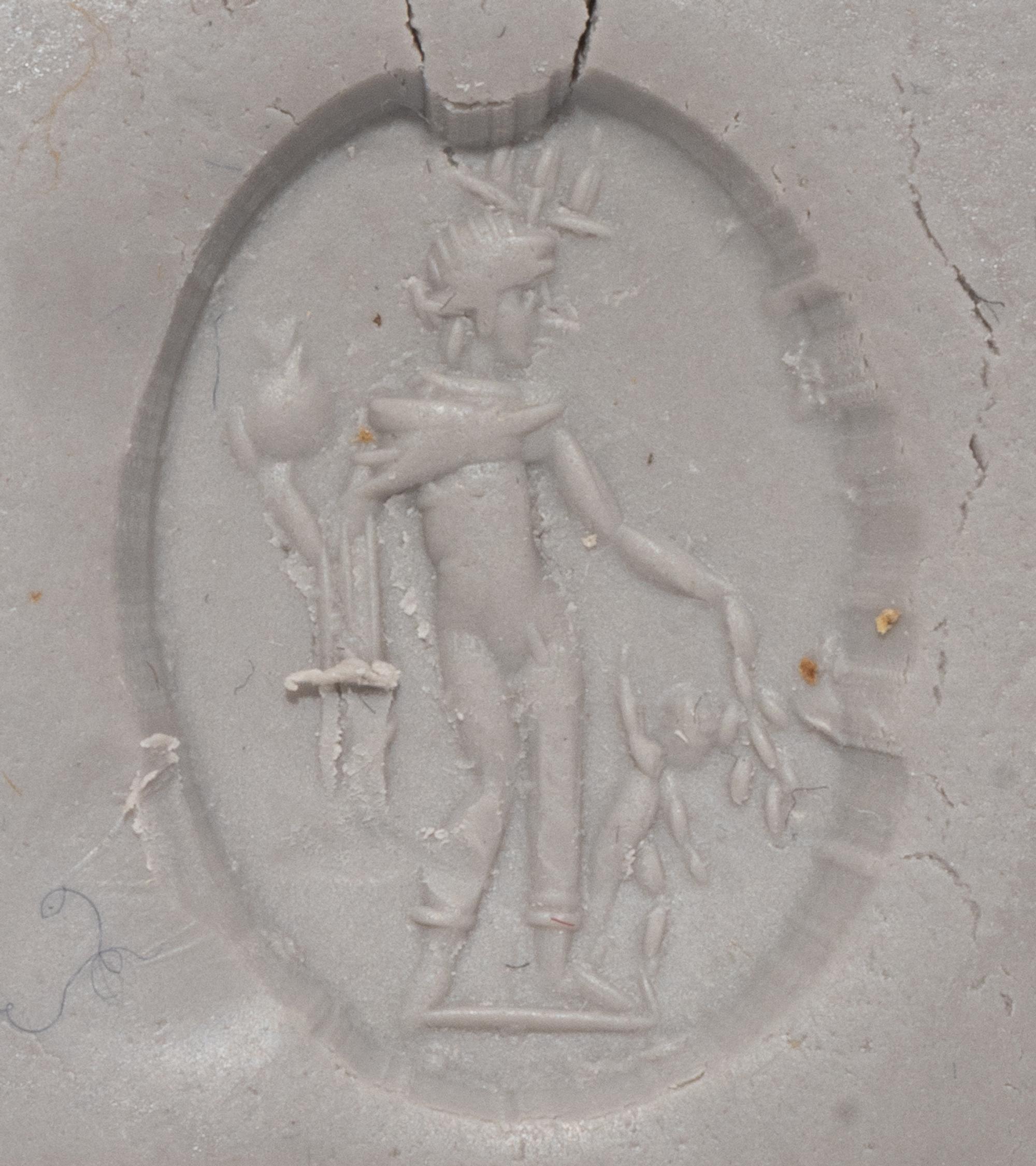 A Roman Carnelian Ring Stone with the God Mercury and the Infant Dionysus