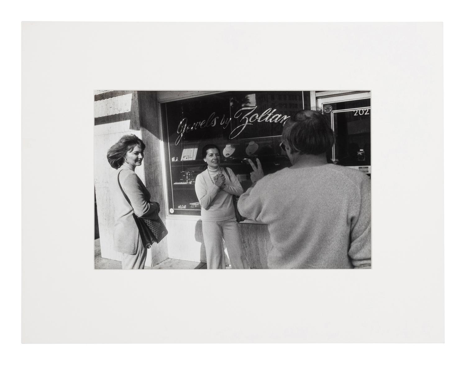 Garry Winogrand (1928-1984) Untitled (Two fans encountering a personality making the peace sign, Beverly Hills), from "Women are Better than Men...", 1982