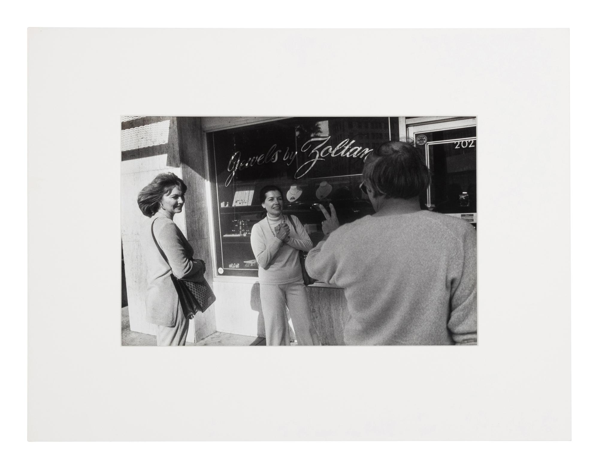 Garry Winogrand (1928-1984) Untitled (Two fans encountering a personality making the peace sign, Beverly Hills), from "Women are Better than Men...", 1982