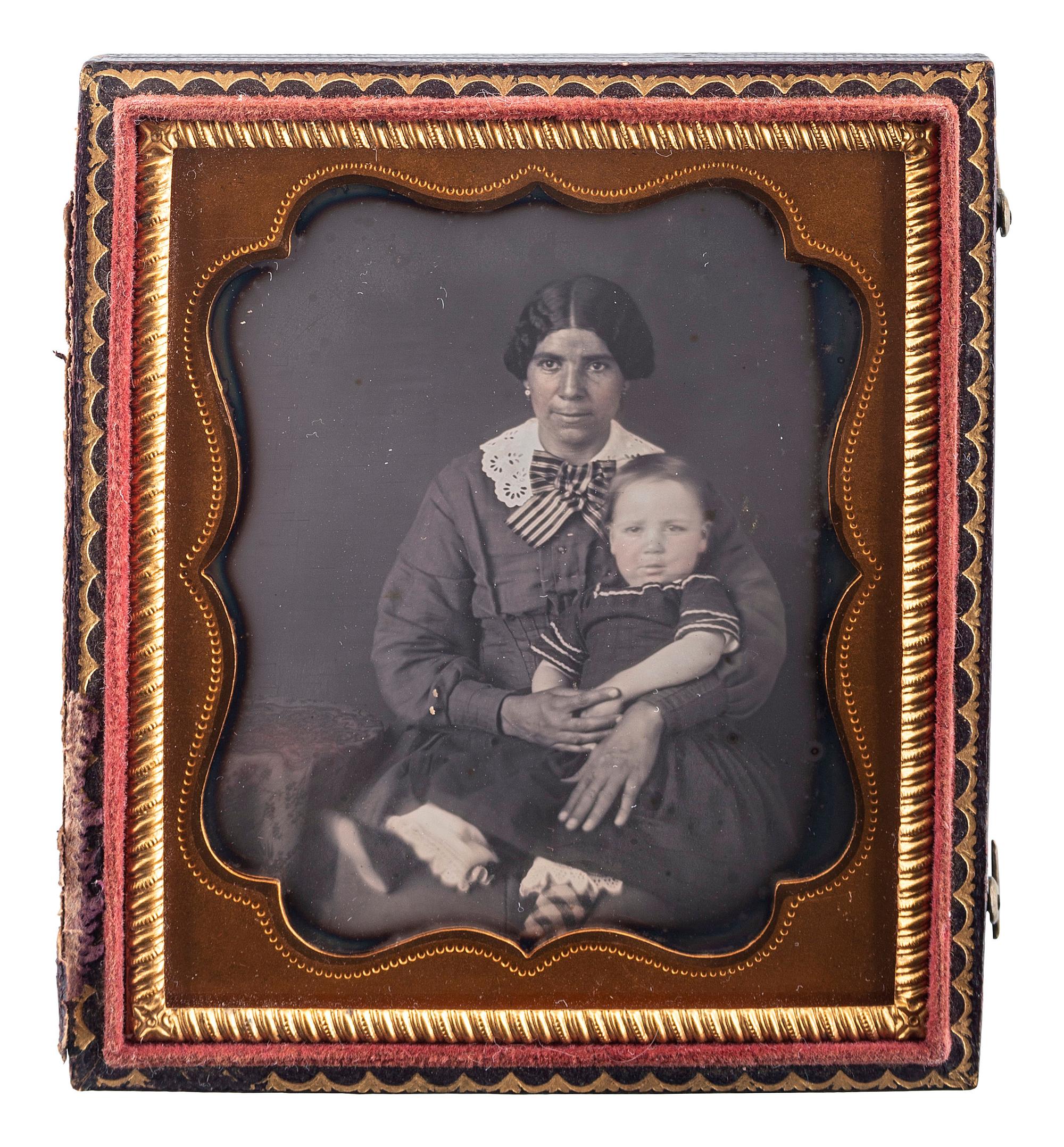 [EARLY PHOTOGRAPHY]. Sixth plate daguerreotype of African American woman with white child.