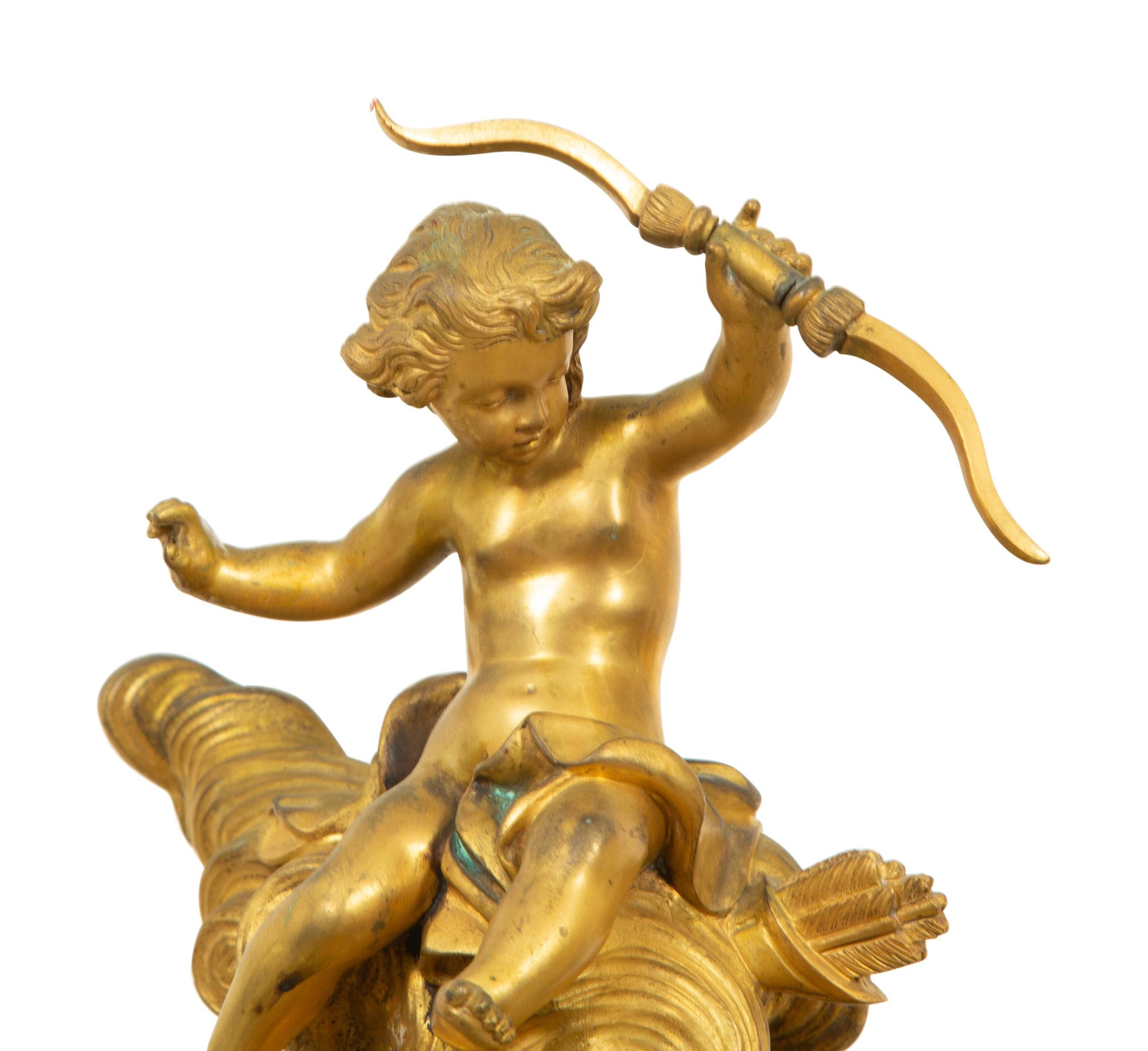 A Louis XV Style Gilt Bronze Clock Garniture