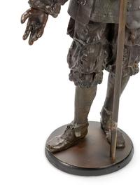 A Pair of Cast Metal Figural Torchères