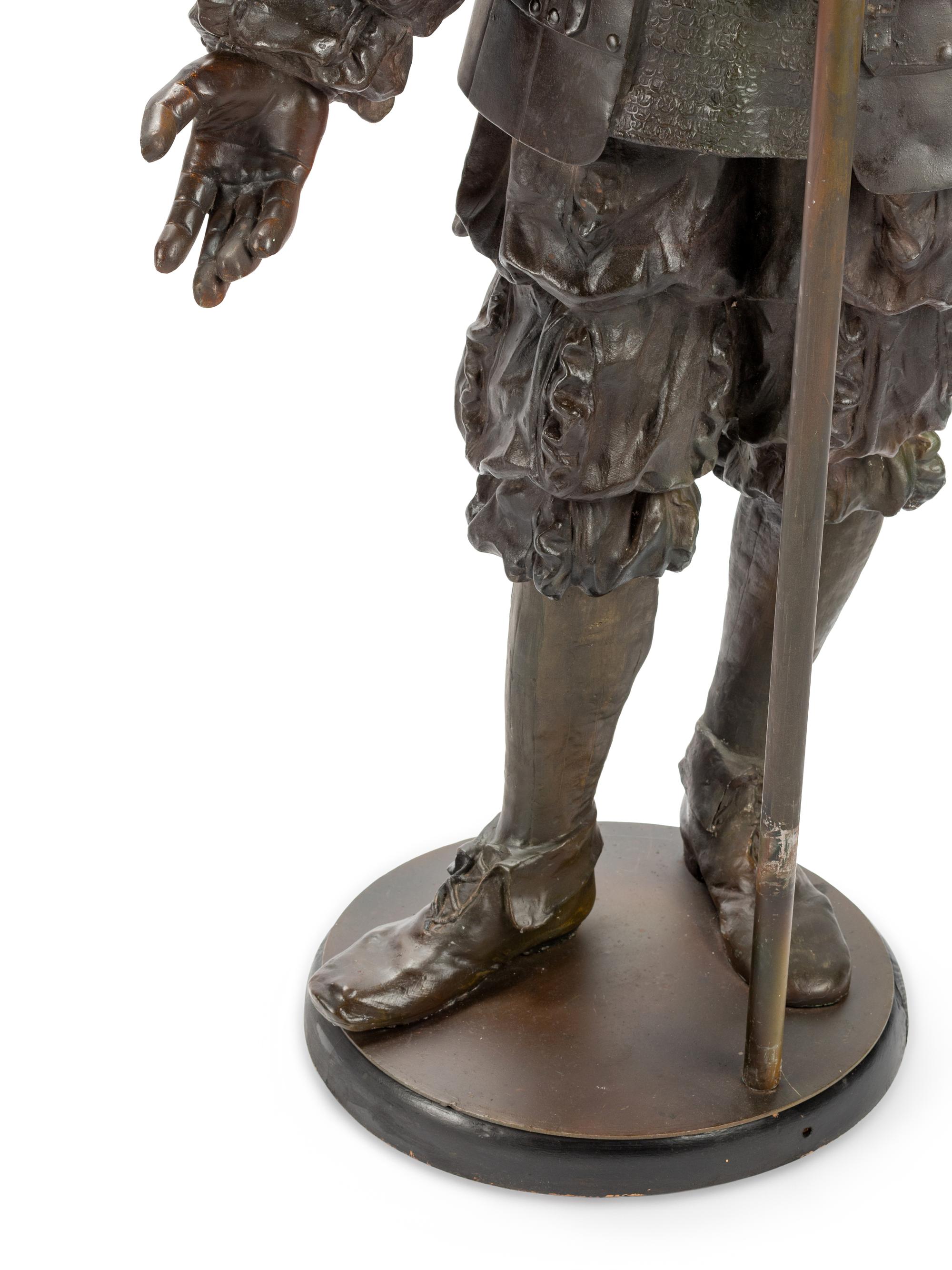 A Pair of Cast Metal Figural Torchères