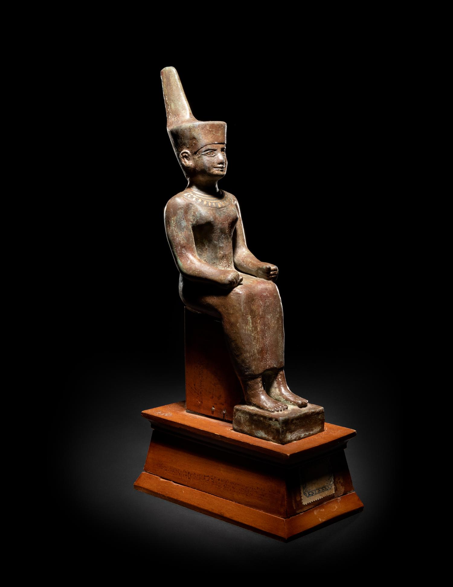 An Egyptian Gold Inlaid Bronze Seated Neith