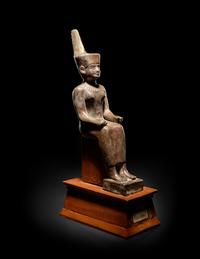 An Egyptian Gold Inlaid Bronze Seated Neith
