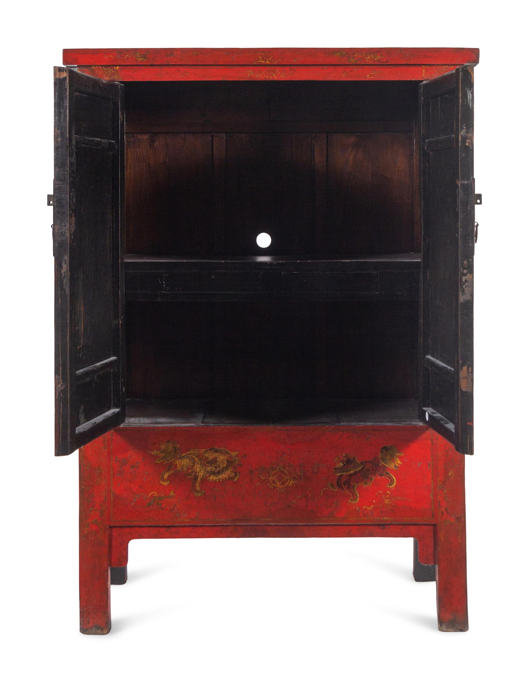A Chinese Export Red Lacquer Cabinet with Gilt Decoration