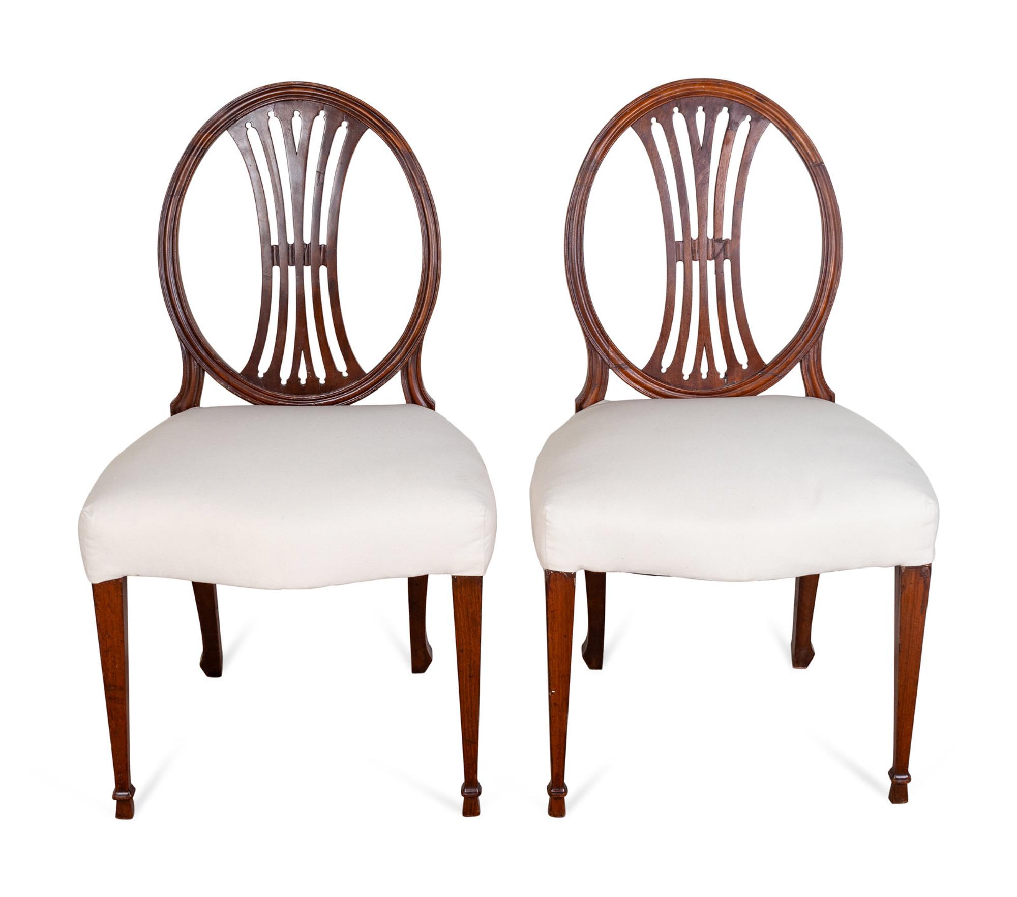 A Set of Six George III Carved Mahogany Dining Chairs