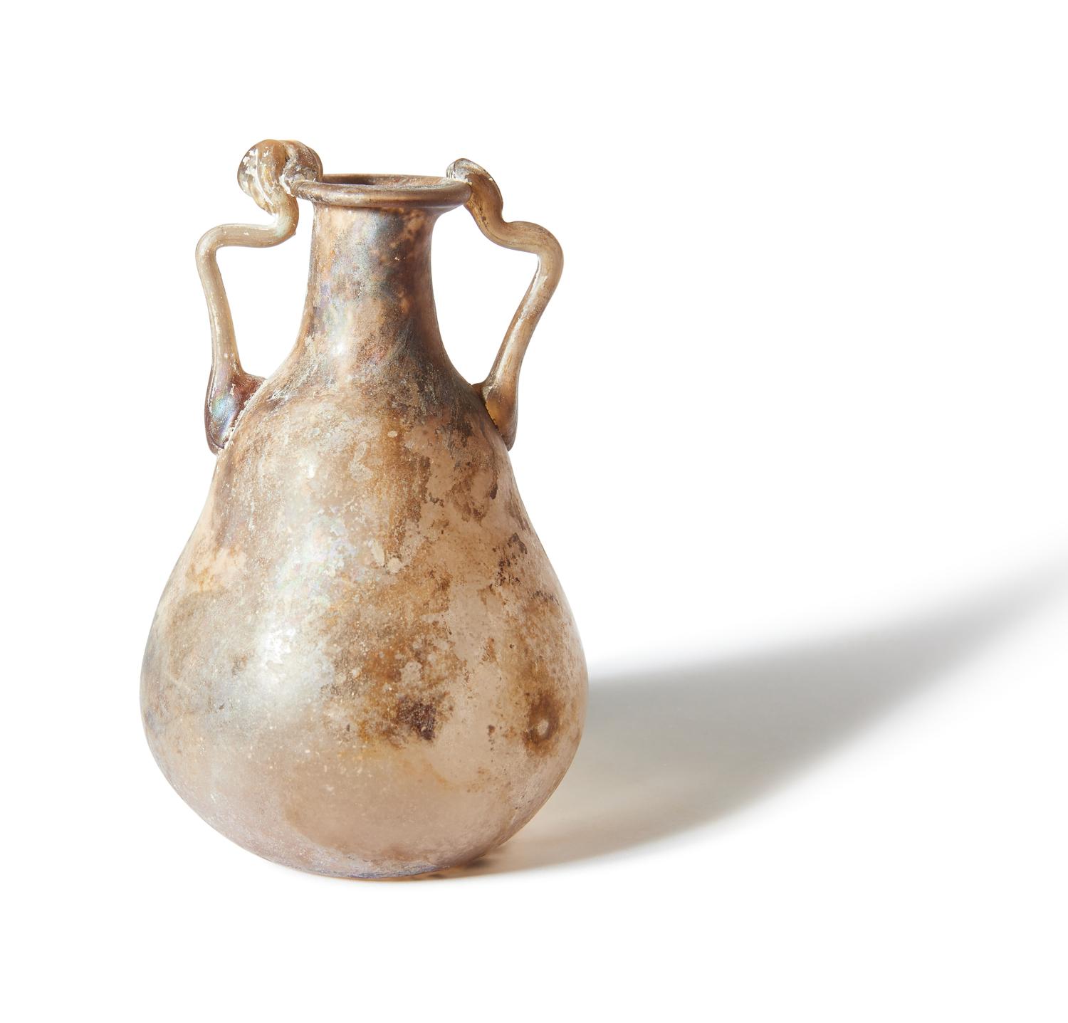A Roman Pale Yellow Glass Bottle