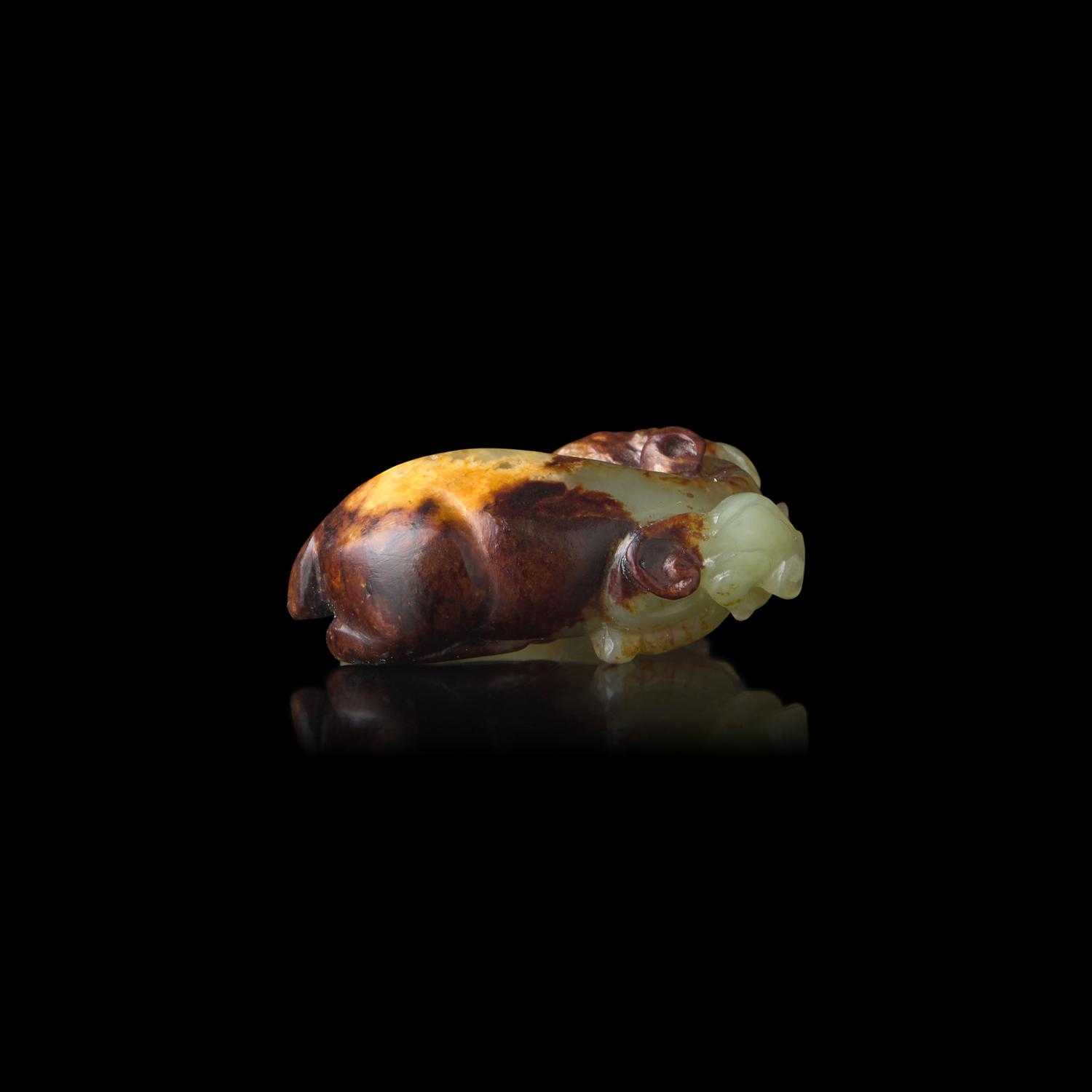 A Small Chinese Celadon Jade Goat, Qing Dynasty or Earlier 清或更早 青玉臥羊把件
