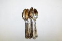 A Set of Nine American Silver Teaspoons, Reed & Barton, Taunton, MA, the handle decorated with floral and vine elements in the Art Nouv