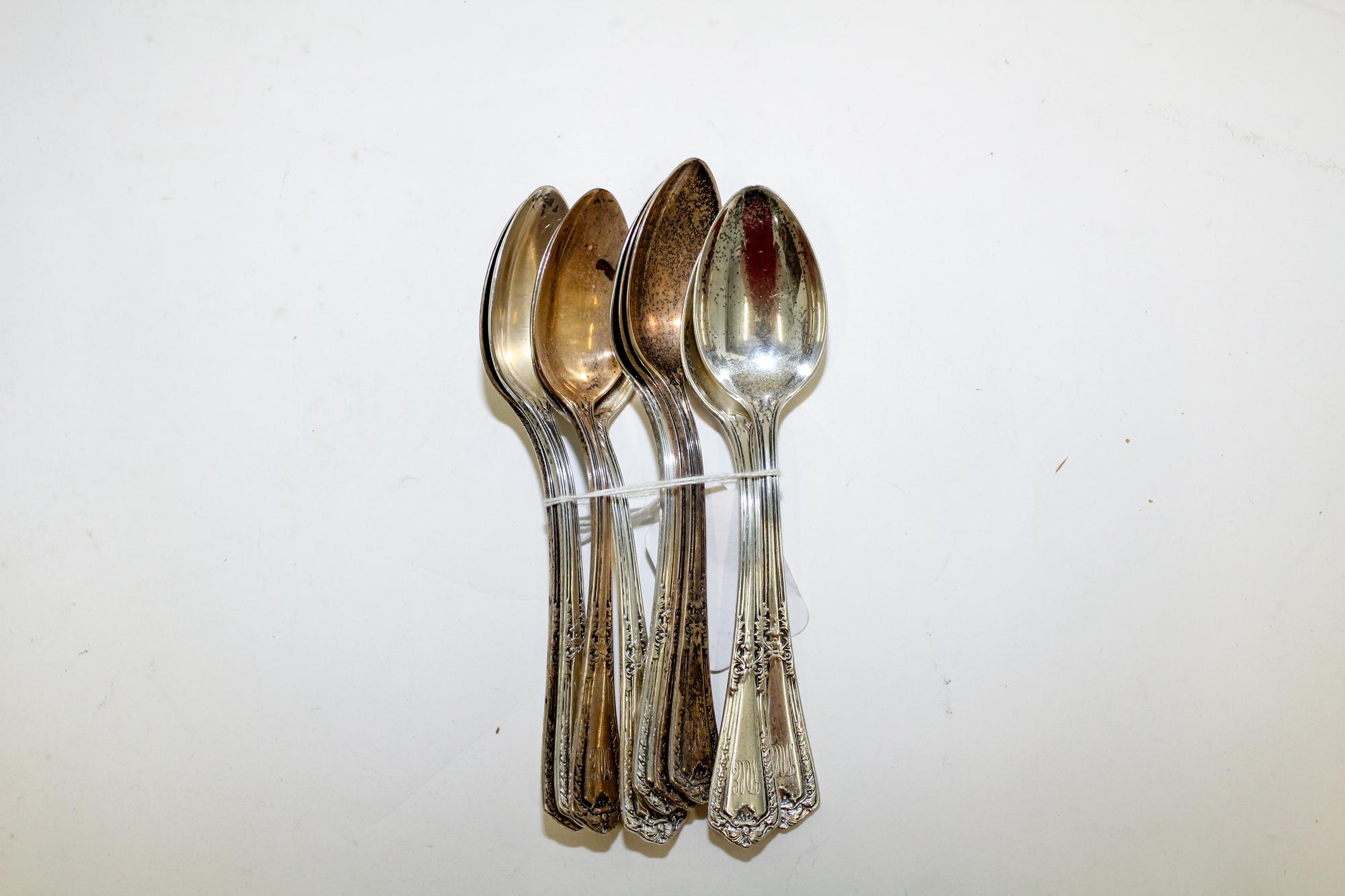 A Set of Nine American Silver Teaspoons, Reed & Barton, Taunton, MA, the handle decorated with floral and vine elements in the Art Nouv