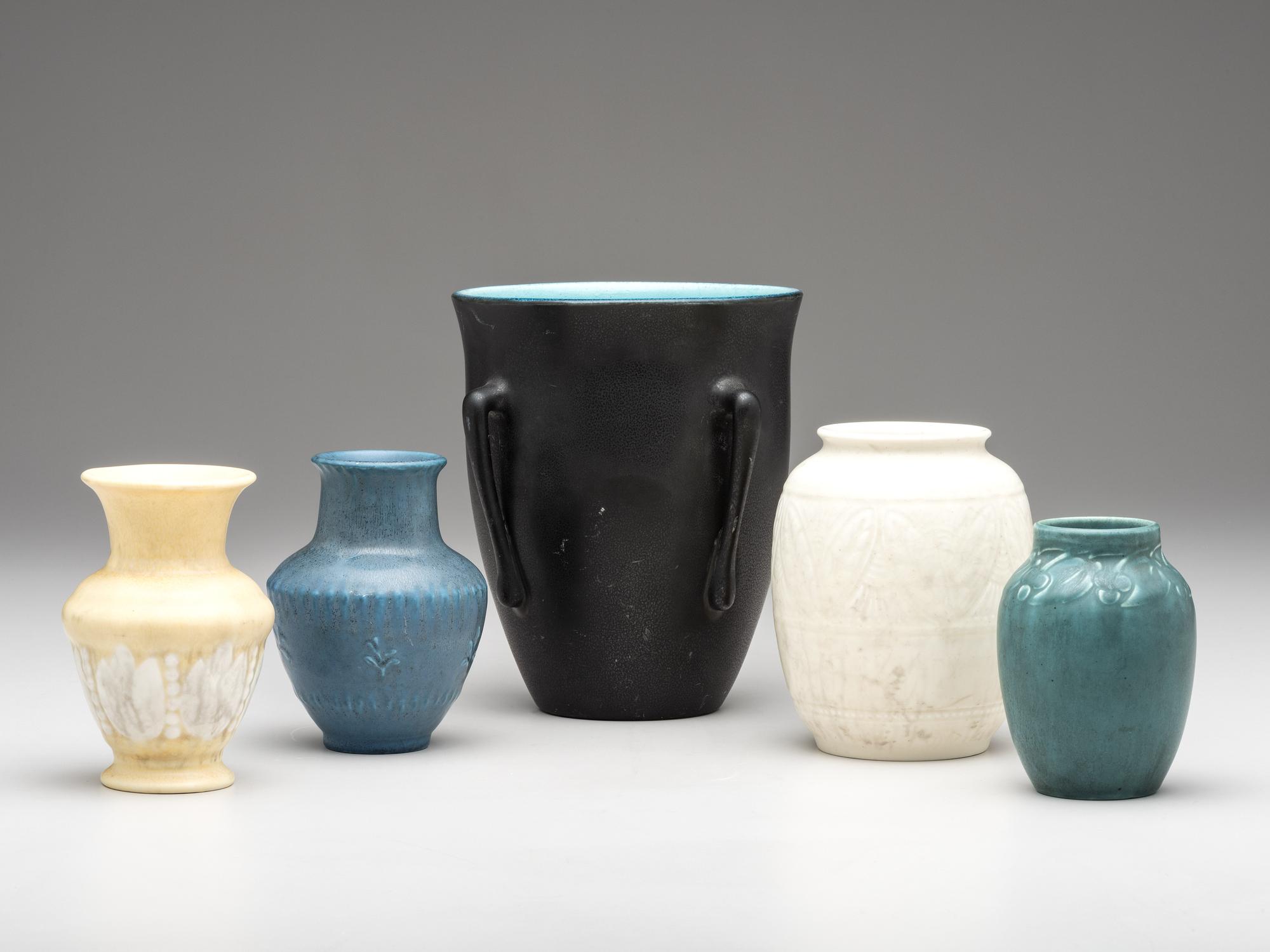 Five Carved and Mat Vases