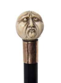 A Japanese Ivory Handled Walking Stick, Diameter of handle 1 1/2 x length overall 36 3/8 inches.
