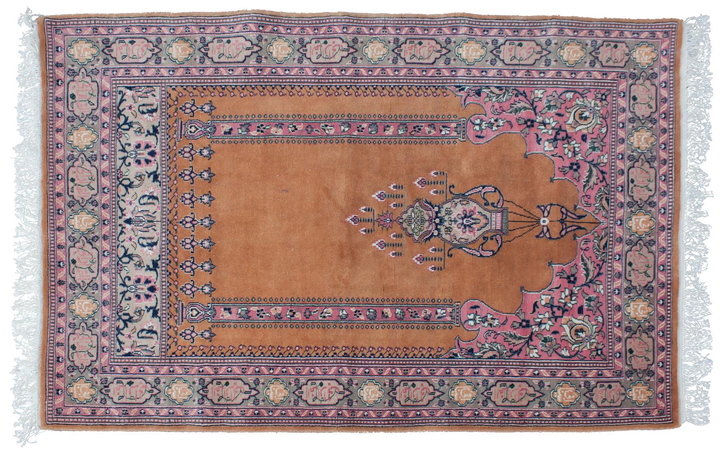 An Oriental Wool Rug 4 feet 2 inches x 6 feet 2 1/2 inches.