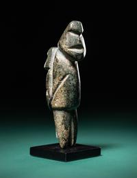 A Mezcala Diorite Standing Figure with an Infant