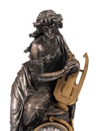 A French Gilt Bronze and Cast Metal Figural Clock