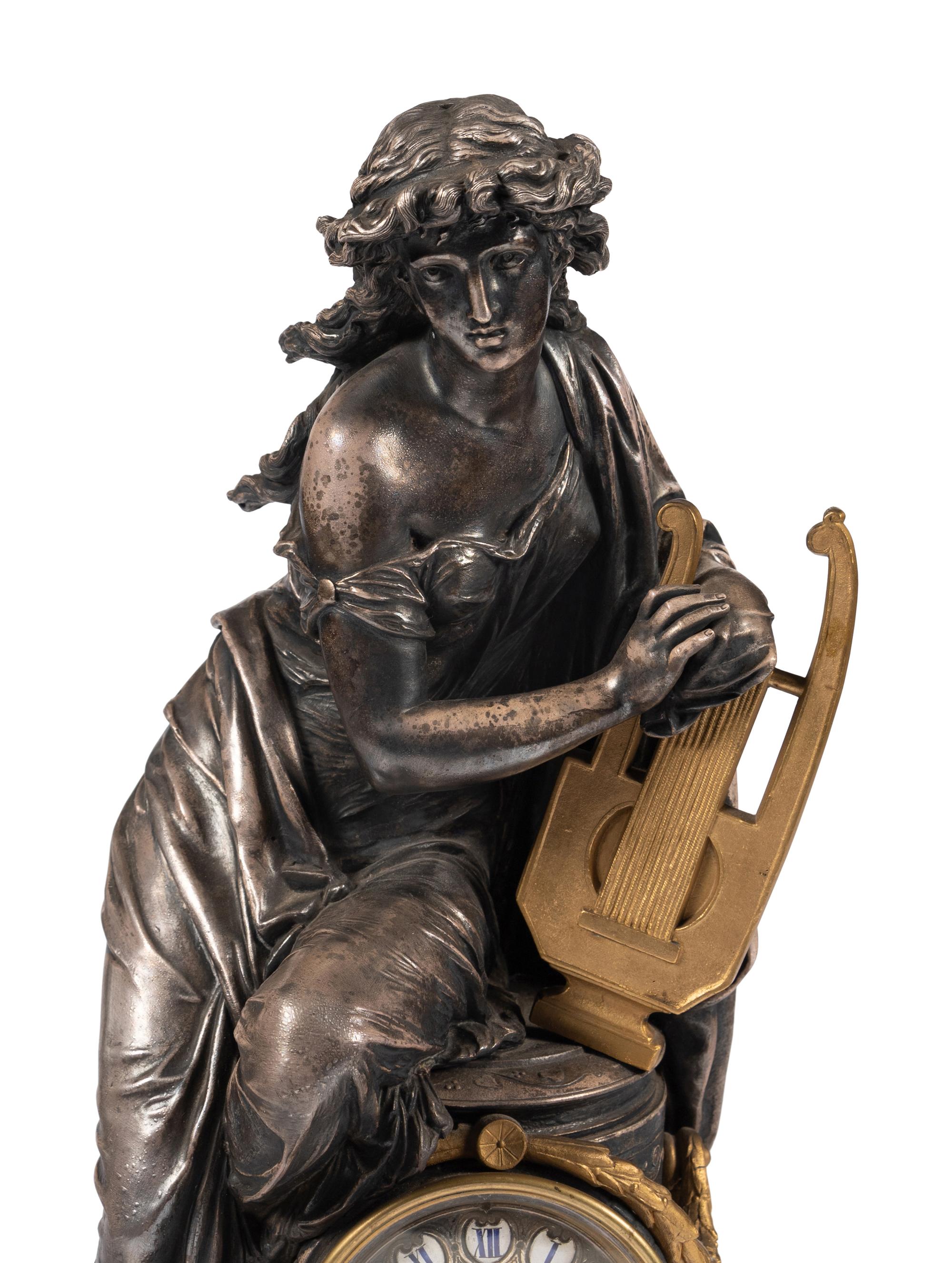 A French Gilt Bronze and Cast Metal Figural Clock