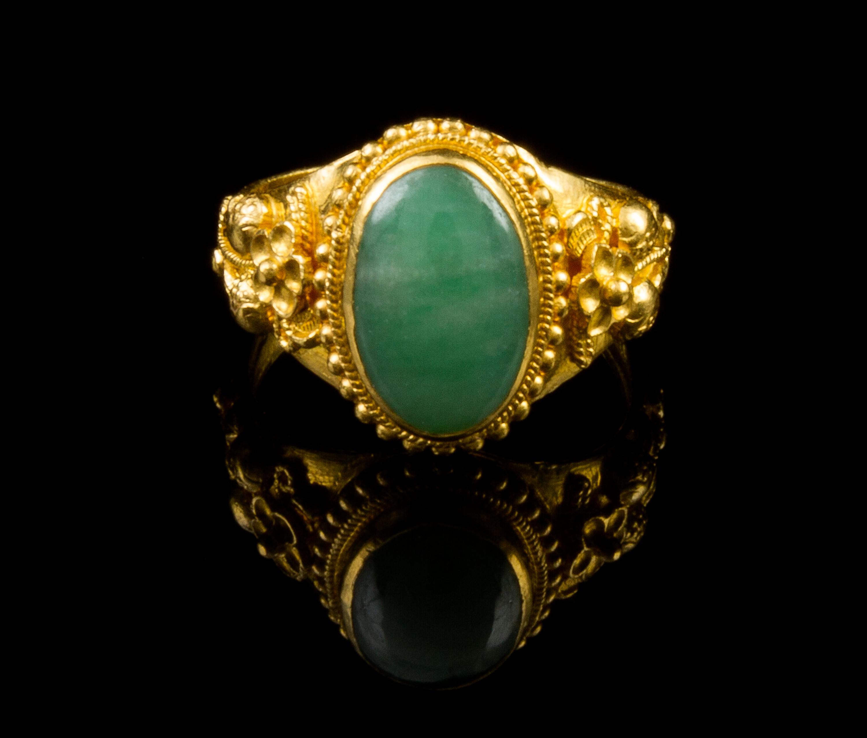 A Chinese 22 Karat Gold and Jadeite Ring Diameter 7/8 inches.